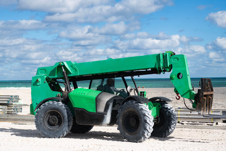 Boom lift green color outdoor. Machine equipment. Heavy crane equipment. Boom lifting machinery....