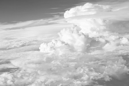 blue sky with a few clouds. The sky is very bright and the clouds are scattered throughout. White...
