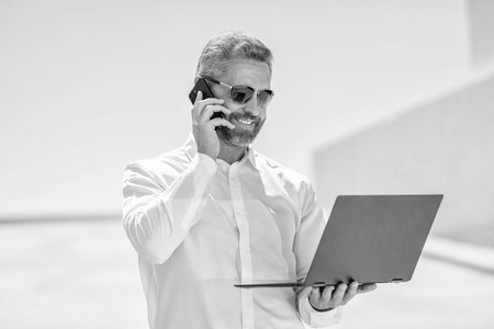 Man has business phone call. Successful businessman freelancing online. Business man working online....