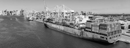 Miami, Florida, USA - March 20, 2025: Cargo ship vessel. Miami port. Container export ship. Cargo...