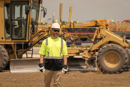 Supervisor worker wear uniform. Top supervisor at work. Labor day. Building side outdoor. Man at...