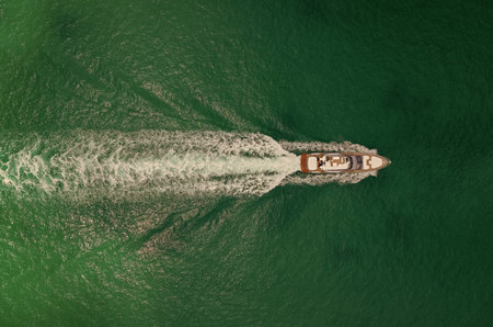 Sea boat go to yacht marina. Yachting and boating marina. Yacht boat sailing. Aerial view luxury...