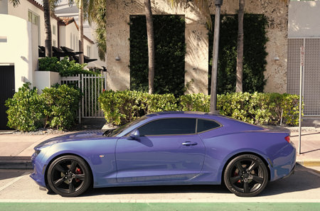 Miami, Florida, USA - December 11, 2024: 2016 Chevrolet Camaro Chevy metallic blue car. Luxury car...