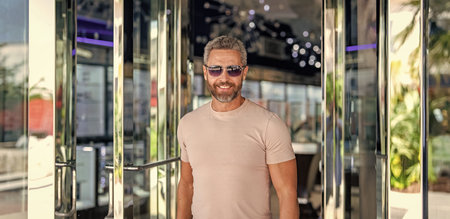 Stylish handsome man with graying hair. Stylish male. Male casual style. Portrait mature man in...