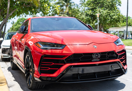 Miami, Florida, USA - July 27, 2025: Red car, front view. Lamborghini Urus 2021 super SUV car. Luxury super SUV Lamborghini Urus. Car Lamborghini Urus parked outdoor.のeditorial素材