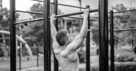 Strong athlete. Man pullup. Muscular man sportsman with strong back muscle. Sport pullup workout....