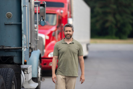 Semi trucks vehicle. Hispanic man trucker. Hispanic man driver in front of truck. Trucking owner....
