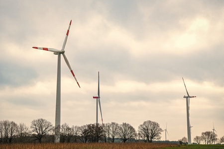Windmill in rural autumn area. Offshore wind park. Wind turbines farm. Alternative renewable energy...