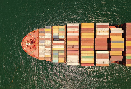 Cargo business. Container ship. Shipping logistics. Commercial shipping. Cargo ship in sea, aerial...