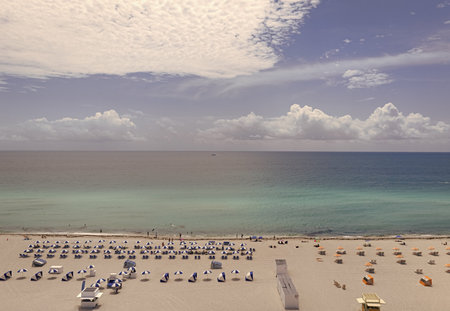 Miami beach with turquoise waters. Aerial view of sandy coastline and waves. Tropical Miami Beach...