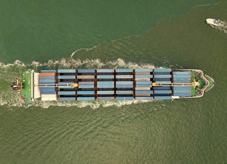 Cargo business. Container ship. Shipping logistics. Commercial shipping. Cargo ship in sea, aerial...