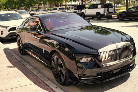 Miami, Florida, USA - April 12, 2025: Car Rolls Royce Spectre parked outdoor. Black electric car,...
