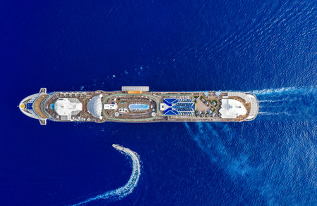 Aerial top view of cruise summer vacation. Cruise ship tour and travel at sea. Aerial luxury liner voyage. Ship top view. Luxury liner resort. Cruise ship voyage. Entertainment deck