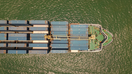 Freight container loaded on cargo vessel. Aerial ship with container. Cargo business. Container ship. Shipping logistics. Commercial shipping. Cargo ship in sea, aerial view. Cargo ship deck