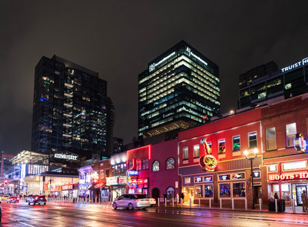 Nashville, Tennessee, USA - January 22, 2026: Night city skyscraper. Architecture office building. Illuminated city. Downtown night city. Business skyscraper building. Architectural urban building