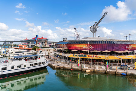 Miami, Florida, USA - November 03, 2024: Miami Bayside Marketplace Hard rock cafe. Docked boats at Bayside Marketplace in Miami on sunny summer day. Boats at pier. Bayside Marketplace marina bay