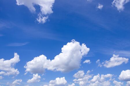 Panorama of fluffy sheep clouds against a blue skyの写真素材