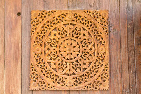 Pattern of flower carved on wood backgroundの写真素材