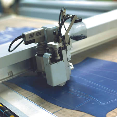 How to build a shoe. Laser that cuts the leather following the design of the shoeの写真素材