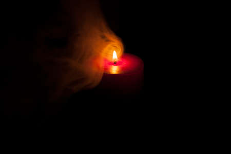 Close up of votive candles, twilight, in a dark Christian church. Selective focusの写真素材