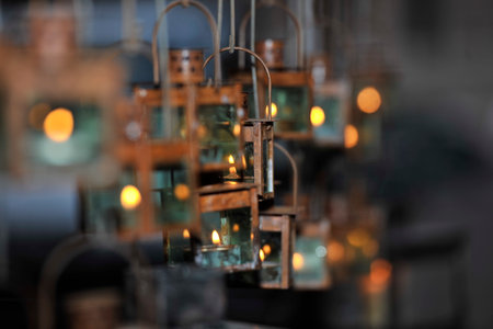 Candle in the jar hanging from the ceiling for the wedding celebration. Selective focus