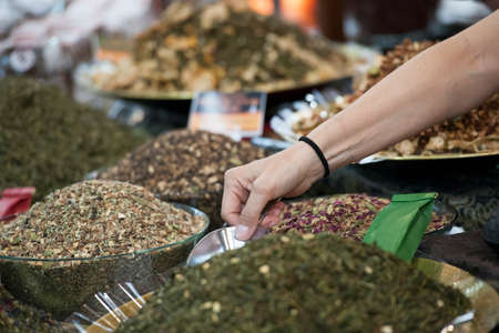 Various oriental spices on sale in market stand.の写真素材