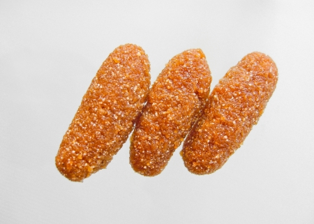 thai dessert called kao-tu or dried rice balls made from rice and coconut isolated on white backgroundの写真素材