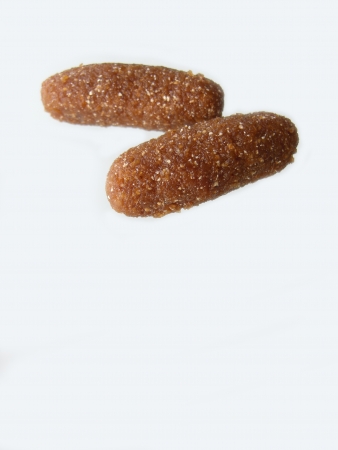 thai dessert called kao-tu or dried rice balls made from rice and coconut isolated on white backgroundの写真素材