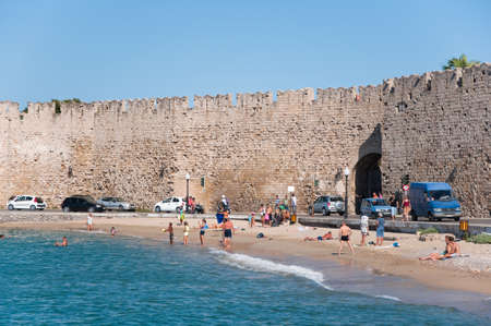 Mandraki harbor and a beach on July 1, 2013  Rhodes, Greece のeditorial素材