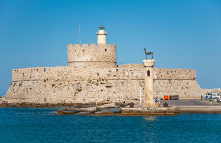 The old fortress and the lighthouse on Rhodes island, Greece 