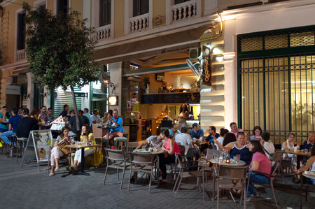 CRETE,HERAKLION-JULY 24: Nightlife in Heraklion city next to Lions Square on July 24,2014 on the island of Cete in Greece.のeditorial素材