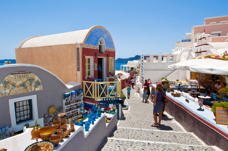 THERA,OIA-JULY 28: Tourists do shopping on July 24,2018 in Oia town on the Thera(Santorini) island, Greece.のeditorial素材