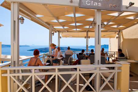 SANTORINI,FIRA-JULY 28: Local restaurant with volcano view on July 28,2014 in Fira town on the Santorini island, Greece. Fir? is the modern capital of the Greek Aegean island, Santorini.のeditorial素材