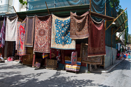 ATHENS-AUGUST 22: Carpets displayed for sale in Plaka area on August 22, 2014 in Athens, Greece. Plka is the old historical neighbourhood of Athens, clustered around the slopes of the Acropolis.のeditorial素材