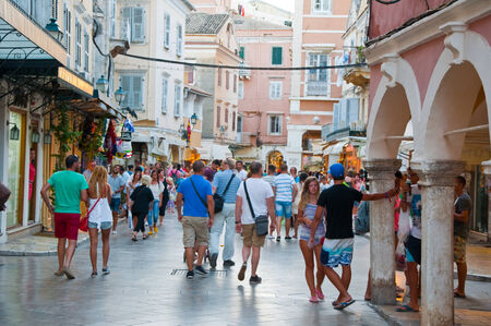 CORFU-AUGUST 22: Kerkyra old town with the row of souvenirs shops on August 22, 2014 on Corfu island, Greece.のeditorial素材