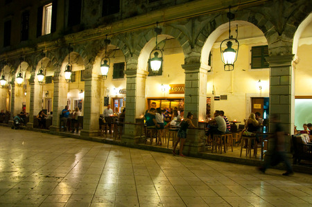 CORFU-AUGUST 22: Detail of the Liston of Corfu at night in Kerkyra city with the row of local restaurants on August 22, 2014 on Corfu island, Greece.のeditorial素材