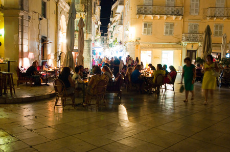 CORFU-AUGUST 25: Nightlife in Kerkyra town, crowd of tourists around on August 25, 2014 on the Corfu island, Greece.のeditorial素材