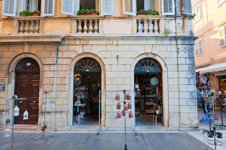 CORFU-AUGUST 27: Venetian Kerkyra city with the row of souvenirs shops on August 27, 2014 on Corfu island, Greece.のeditorial素材