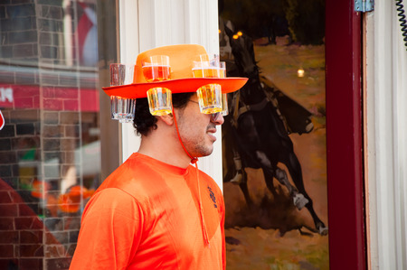 AMSTERDAM NETHERLANDS APRIL 27: Local in orange on the street on King39s Day on April 2727 in...