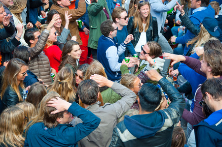 AMSTERDAM APRIL 27: Openair party people dance during King Day on April 27 2015 in Amsterdam the Netherlands. Kings Day is the biggest festival celebrating the birth of Dutch royalty.のeditorial素材