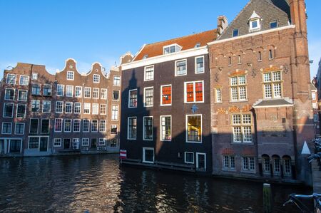 Amsterdam buildings on the water in red light district. The Netherlands.のeditorial素材