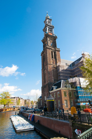 AMSTERDAM-APRIL 30: The bell tower of the Westerkerk as seen from the Prinsengracht canal on April 30,2015, the Netherlands. Westerkerk is a Dutch Protestant church located on the Prinsengracht canal.のeditorial素材