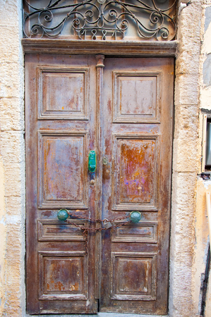 Old front venetian door in old town. Crete, Greece.のeditorial素材