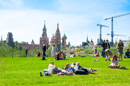 Moscow, Russia May-27,2018: Zaryadye Park  full of locals and tourists relaxing on the grass during the sunny day in Moscow.のeditorial素材