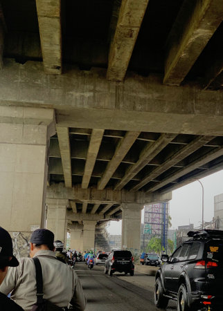 Unidentified people walking under the bridge Jakarta, ndonesiaの写真素材
