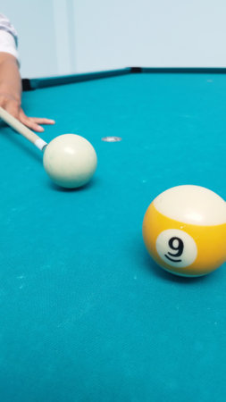 Billiard balls on a blue pool table, billiard concept. young pro billiard player finding best solution at billard or snooker pool sport  gameの写真素材