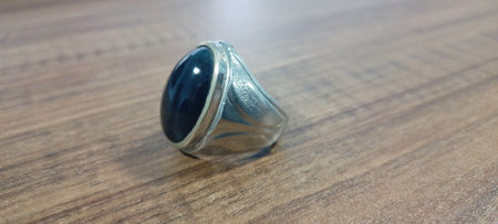 Close up of a Ring with Bacan stone, Bacan stone with the scientific name Krisokola. This stone is an important gemstone during the sultanates of Bacan, Jailolo, Tidore and Ternate, Indonesiaの写真素材