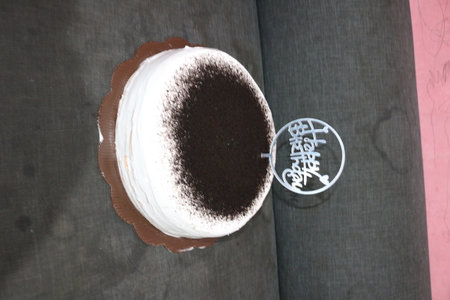 Chocolate cake with Japanese calligraphy on top, closeup of photoの写真素材
