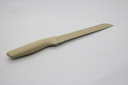 Long knife in gray color, white background.の写真素材