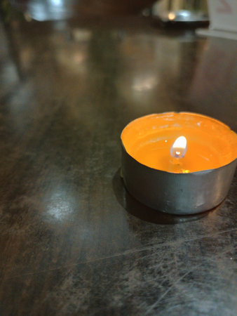 Restaurant table with candles on it, looks aesthetic and artistic.の写真素材